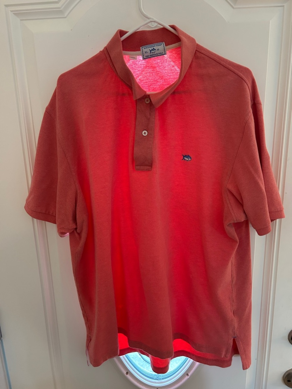 Southern Tide Men's Coral/Salmon Polo Shirt with Fish Logo. 97% cotton.